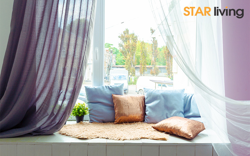 bay windows behind the pillows and curtains